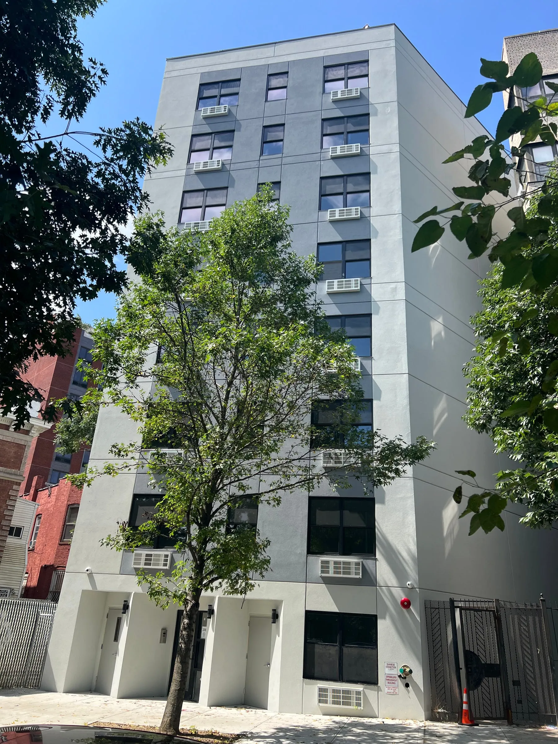 A finished eight-storey building on a New York street.
